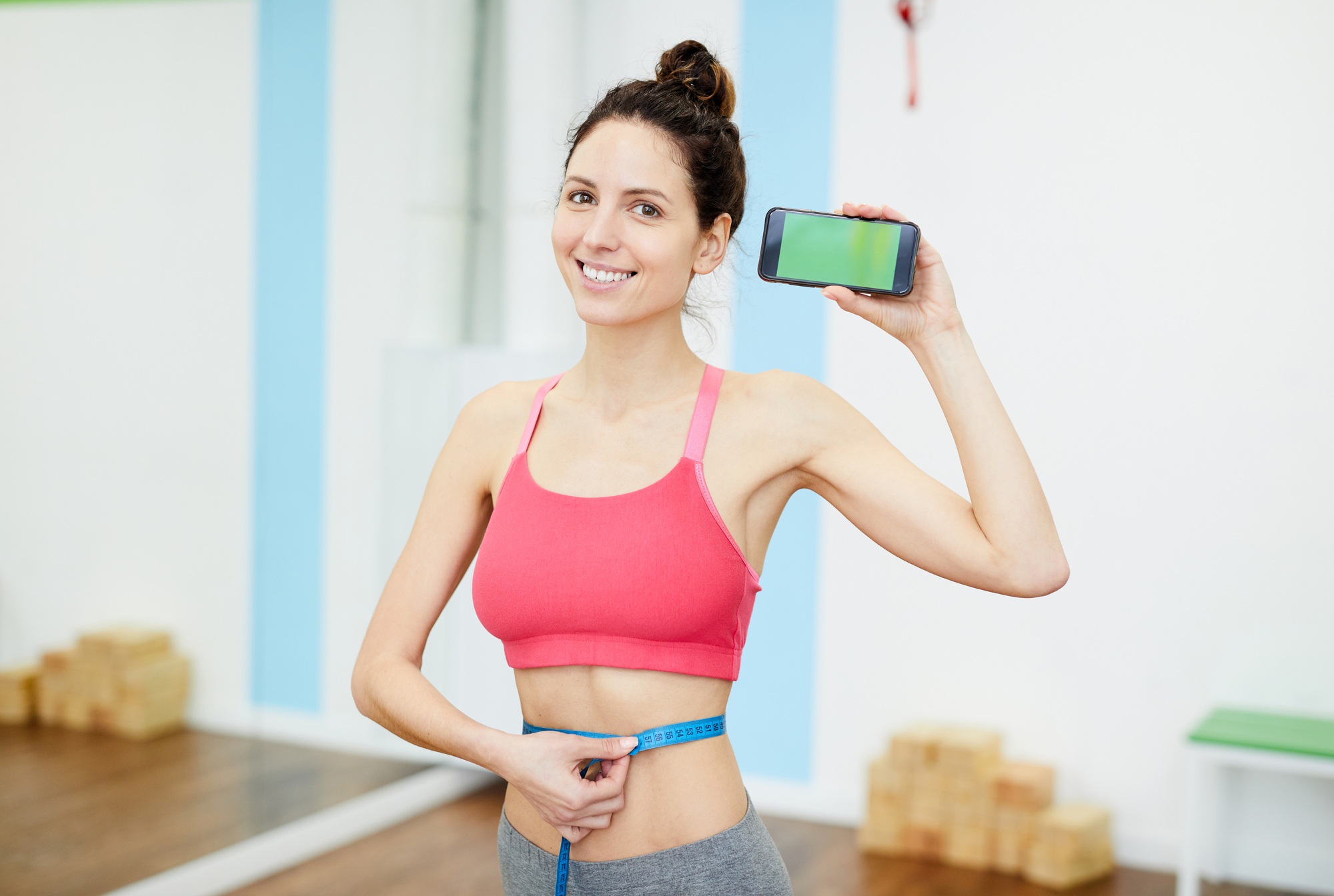 Smiling Woman Presenting Weightloss App